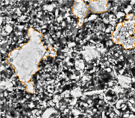 bsem data with three large chalk grains outlined from the gmm process (orange). The image shows mostly brecciated chalk grains with some interspersed circular oolites.